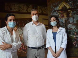 Verso Mostra Raffaello in corso restauro Stendardo per Cinquecentenario